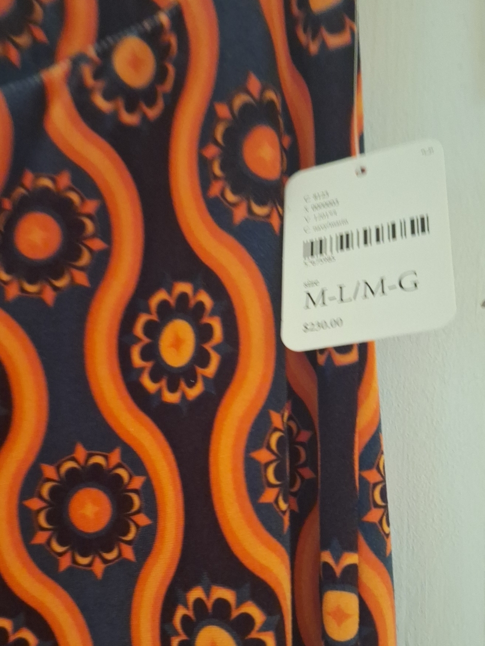 Free People Retro Orange Floral Wave bell bottom valur pants  - Size M/L